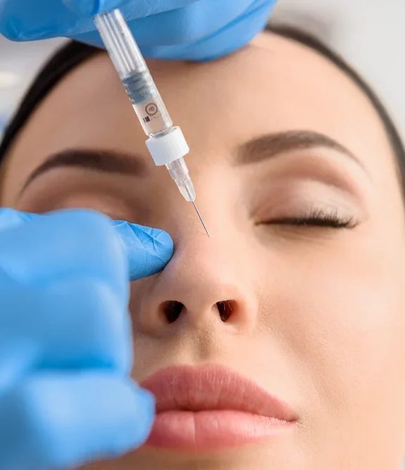 A medical professional performing a targeted liquid rhinoplasty injection on a patient's nose at Simple Radiance Medspa in Austin, TX.